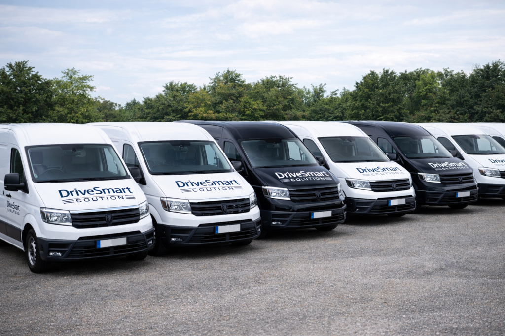 Fleet of vans with DriveSmart logo